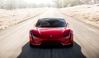 Tesla Roadster красного цвета 2025 года на 21 колёсах фото 2