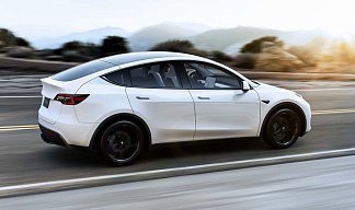 Tesla Model Y Performance белого цвета 2025 года фото 1